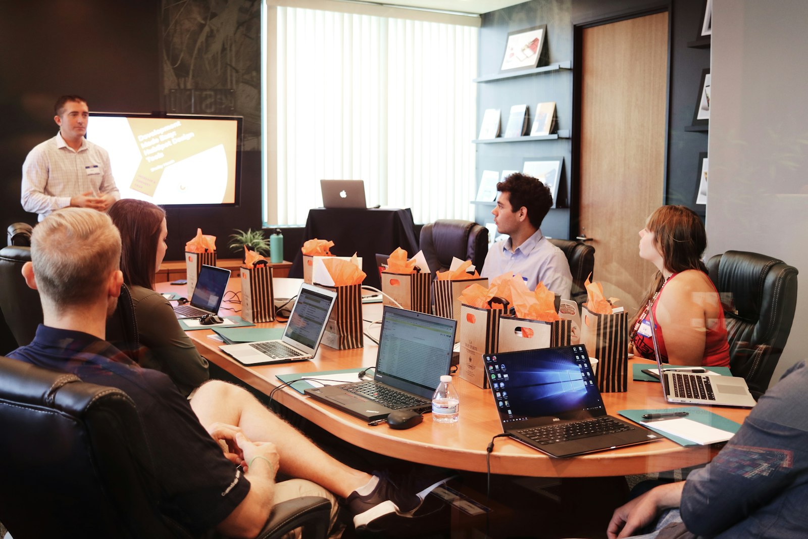 Client and strategist reviewing campaign flight results at the studio table